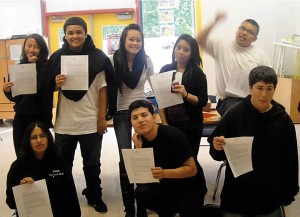 Youth-proudly-raise-their-scholarship-letters-to-City-College-of-San-Francisco