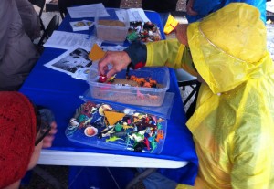 A person creates a scene in a sand tray in the UMSL counseling tent in October. Photo courtesy of Brian Hutchinson.