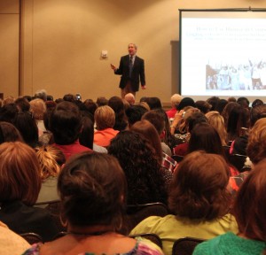 Former ACA President Samuel Gladding delivers a few jokes while standing on a desk during his session "Humor in Counseling: Maximizing a Therapeutic Tool" at the 2015 ACA Conference & Expo in Orlando. Photo by Bethany Bray/Counseling Today