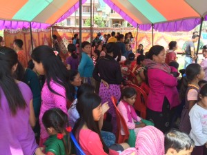 ENG families huddle in a tent to wait out an aftershock.