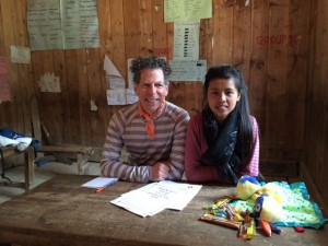 Kottler and an ENG translator wait for their next patient in the "counseling corner" of a makeshift ENG medical center setup in a school.