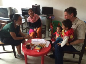 Kottler and one of his students (far left) in the middle of a counseling session with a Nepali family.