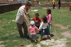 Jeffrey Kottler plays with some Nepali youngsters near an Empower Nepali Girls medical tent.