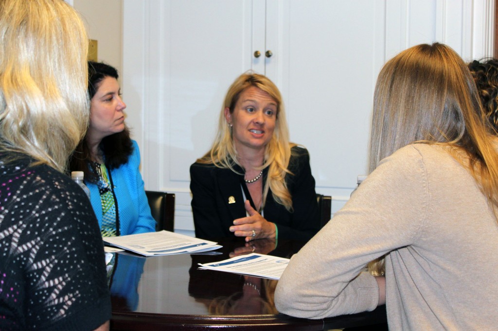 Stephanie Dailey, president of the Maryland branch of the American Counseling Association and senior co-chair of ACA's Ethics Committee, talks with an aide in the office of Rep. Robert Wittman (R-Va.).