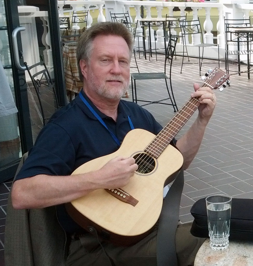 Richard Watts with his guitar.