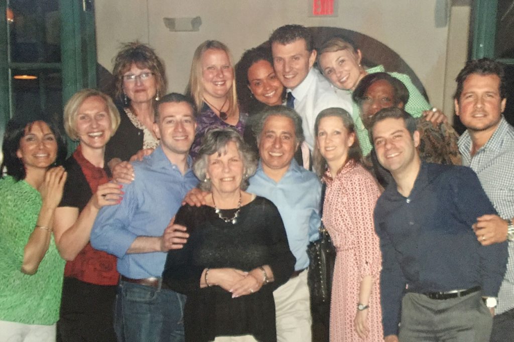 Catherine Roland, surrounded by students from the first counselor Ph.D. cohort at Montclair State University, at a farewell dinner held for her as she was leaving the university in 2013. Roland was instrumental in creating the university’s counselor Ph.D. program. The students gave her this photo in a frame inscribed with the words “Thank you for believing in us!”