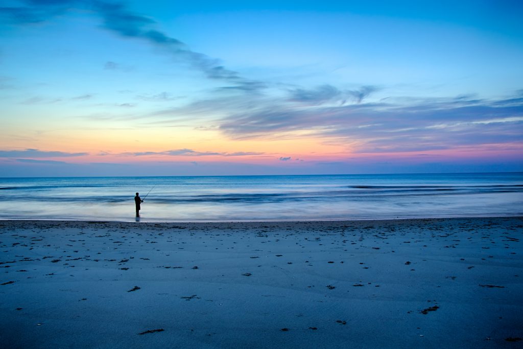 Surf fishing before sunrise in the Outer Banks, North Carolina