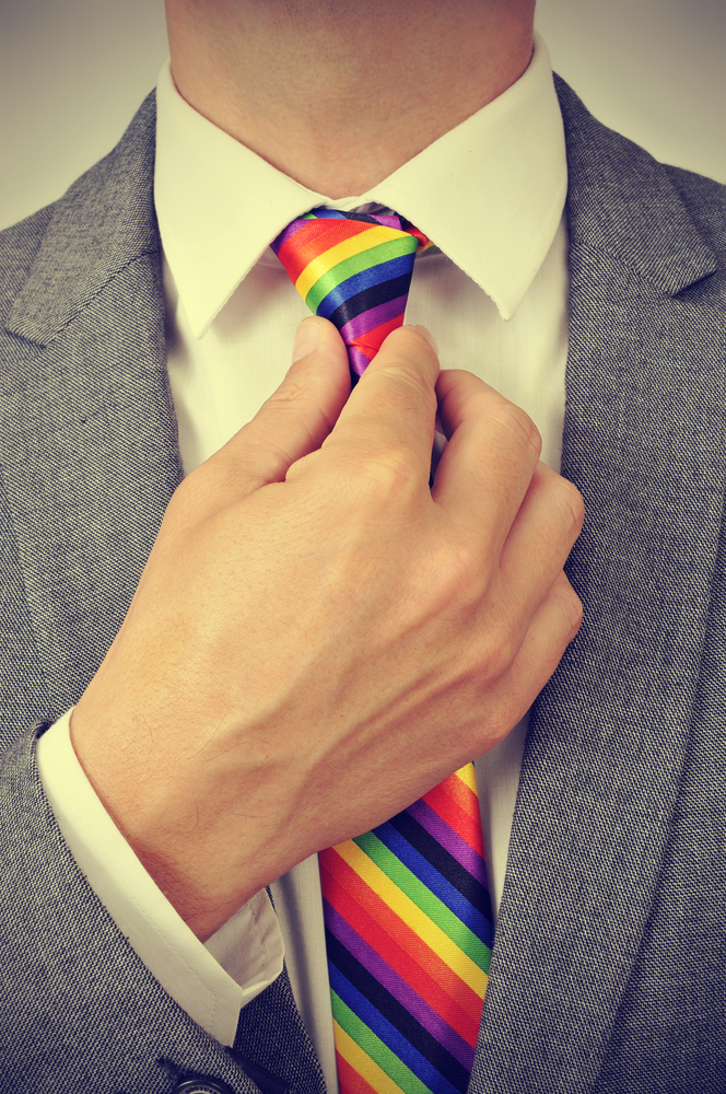 businessman with a rainbow necktie, with a slight vignette added