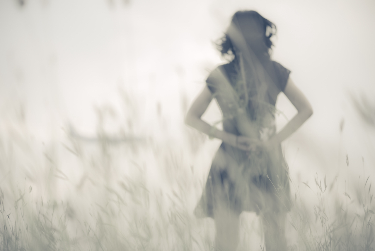 Blur photo of emotions moment of girl with flowers waiting for first summer.