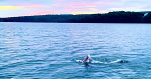 Laurie Craigen swimming across Lake Memphremagog