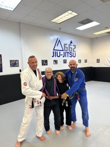 Rick Balkin and his daughter earning a new belt in Brazilian jiu-jitsu